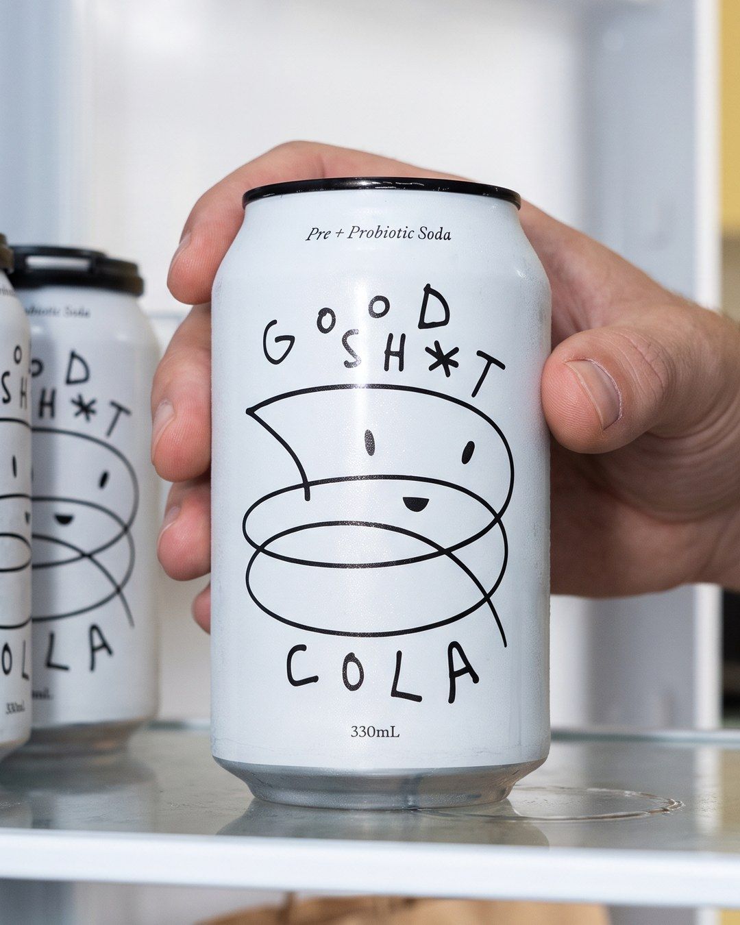 The same can being taken out of a fridge